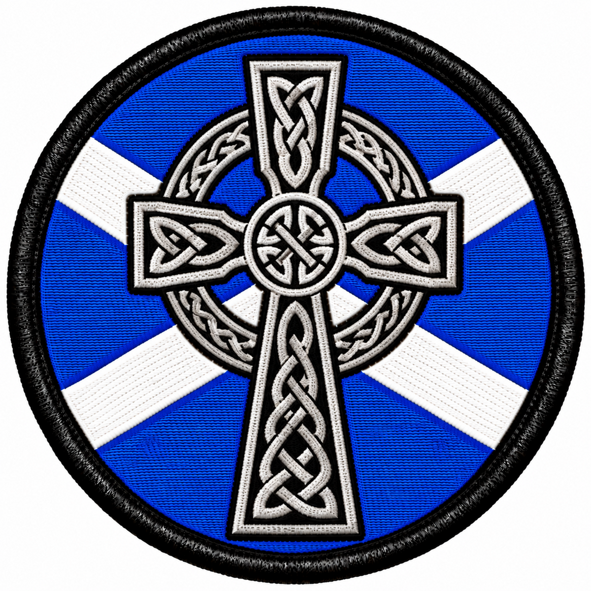 Round 80mm embroidered patch showing a white and black Celtic cross with knotwork over a blue and white Saltire, framed by a black border.
