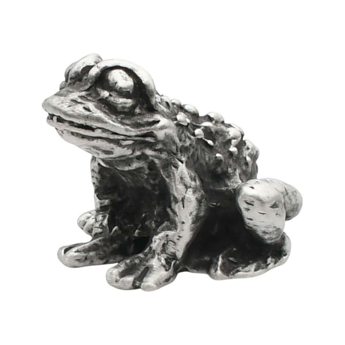 English-made pewter toad figurine ornament, front three-quarter view with large eyes and textured skin
