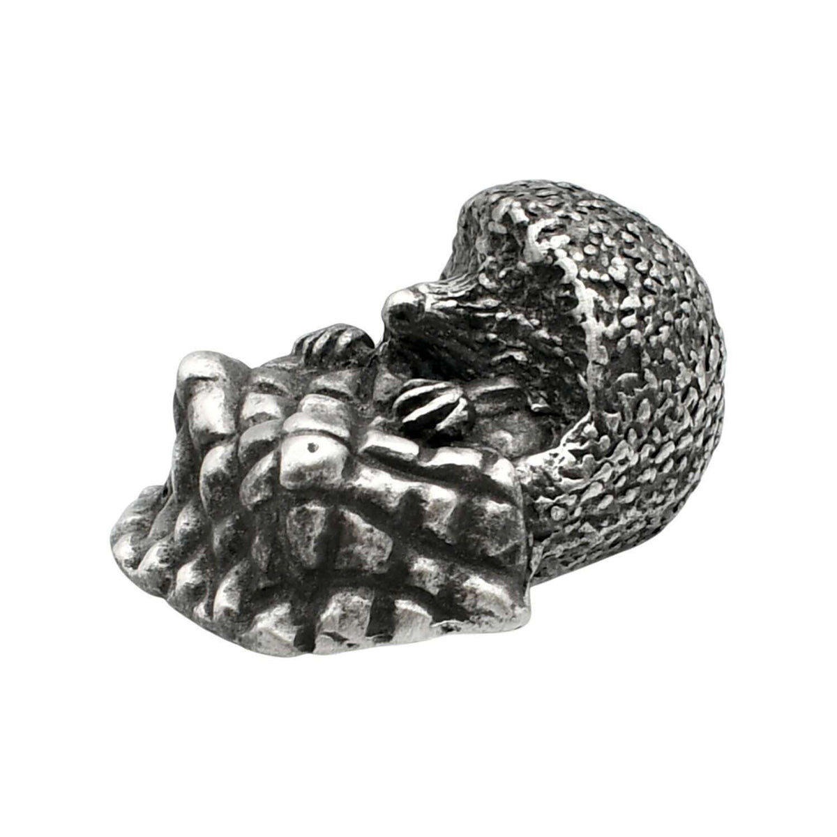 English-made pewter hedgehog with blanket ornament, curled hedgehog with textured spines and folded blanket, first angle