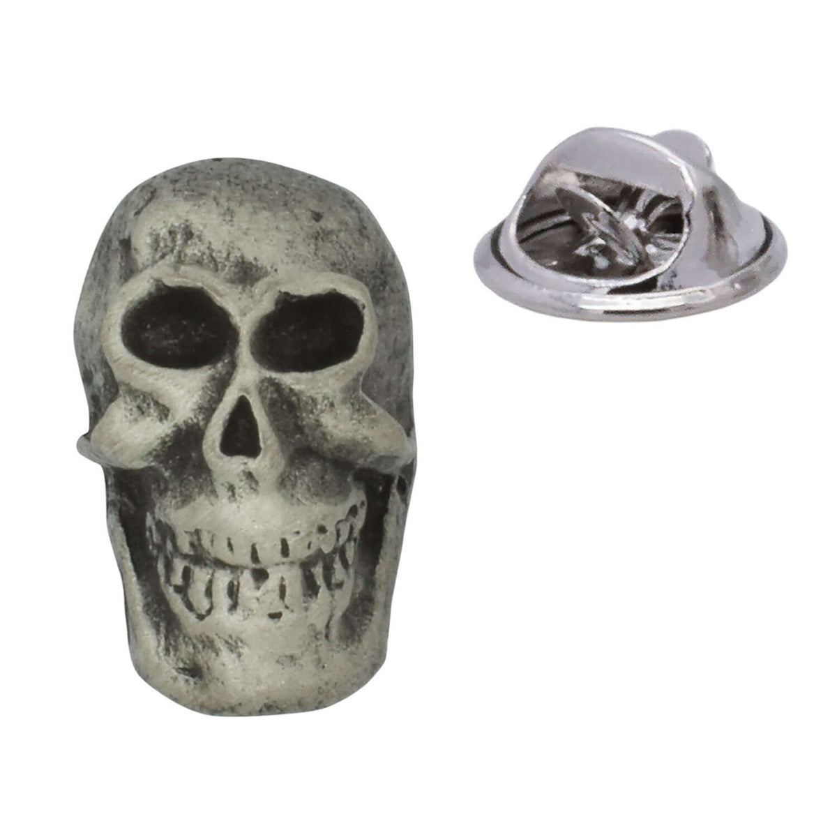Antique silver-coloured skull lapel pin badge showing eye sockets, teeth and butterfly clasp