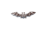Detailed pewter bat pin badge with outstretched wings and butterfly clutch fastening on a white background.