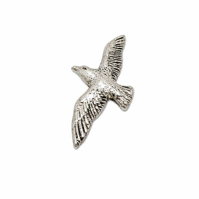 Handcrafted pewter Flying Seagull pin badge featuring a British coastal seabird in flight.