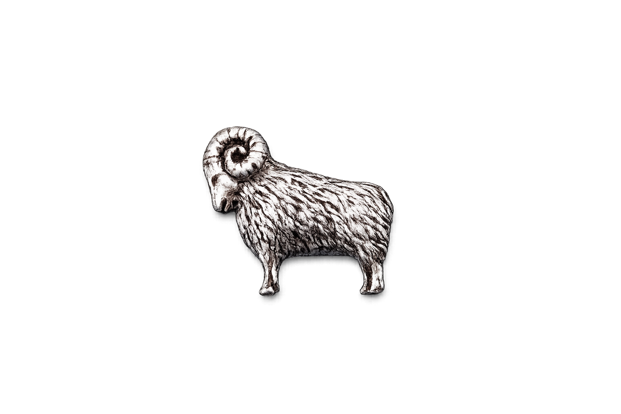 Handcrafted pewter ram pin badge featuring a detailed sheep with curled horns and butterfly clutch fastening on a white background.