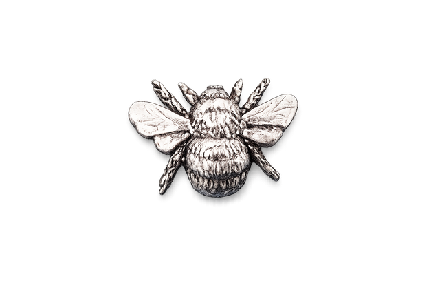 Detailed pewter Bee pin badge with textured body and sculpted wings on a white background.