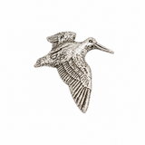 Handcrafted pewter Flying Woodcock pin badge featuring a British woodland game bird in flight.
