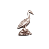 Handcrafted pewter heron pin badge featuring a detailed British wading bird standing in reeds.