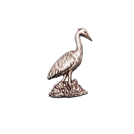 Handcrafted pewter heron pin badge featuring a detailed British wading bird standing in reeds.