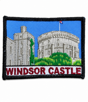 Windsor Castle embroidered patch featuring the historic castle with blue sky, green landscape and black stitched border, suitable for iron-on or sew-on application.