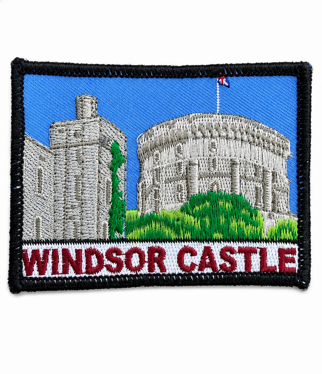 Windsor Castle embroidered patch featuring the historic castle with blue sky, green landscape and black stitched border, suitable for iron-on or sew-on application.