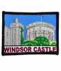 Windsor Castle embroidered patch featuring the historic castle with blue sky, green landscape and black stitched border, suitable for iron-on or sew-on application.
