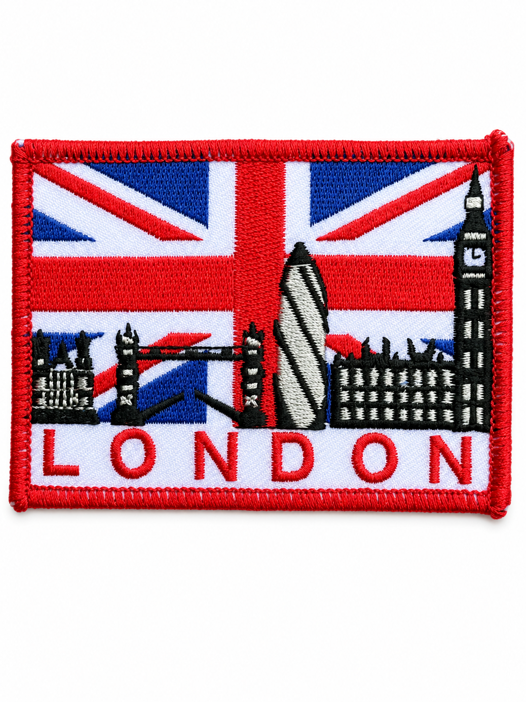London skyline embroidered patch featuring the Union Jack, Big Ben, Tower Bridge and the Gherkin with a red stitched border, suitable for iron-on or sew-on application.