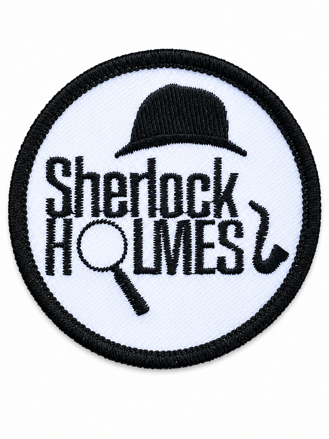 Round Sherlock Holmes embroidered patch featuring a bowler hat, magnifying glass and pipe in black on a white background with a black stitched border, suitable for iron-on or sew-on application.