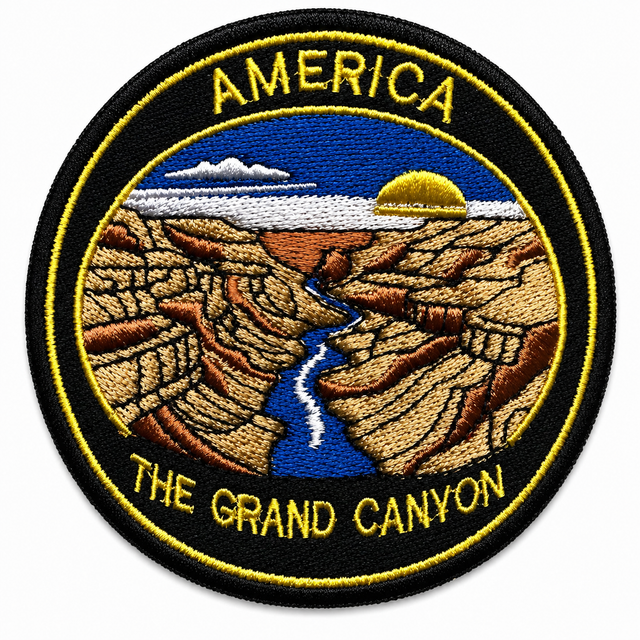 Round embroidered patch featuring the Grand Canyon in America with a canyon landscape, river and sunset, black and gold stitched border, suitable for iron-on or sew-on application.