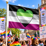 AroAce Aromantic Asexual heart Pride Flag displayed on a flagpole at a Pride rally