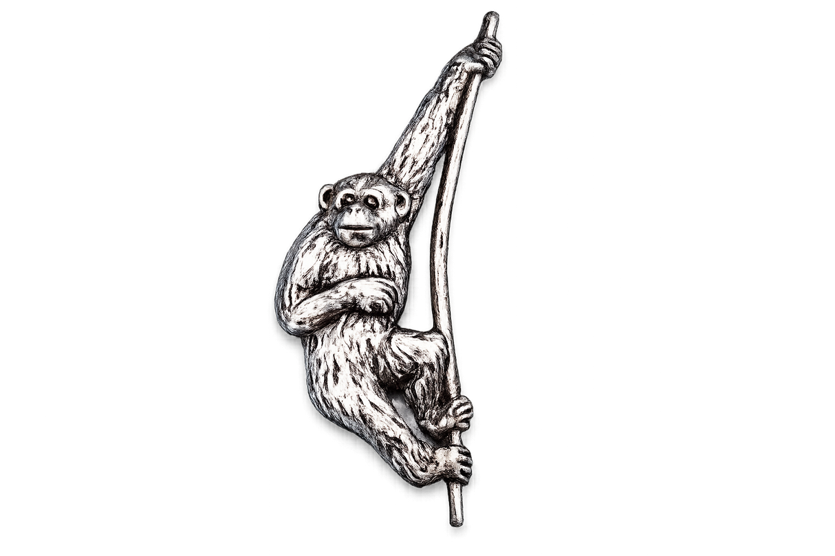 Detailed pewter Gibbon monkey pin badge swinging from a branch with butterfly clutch fastening.