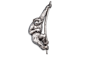 Detailed pewter Gibbon monkey pin badge swinging from a branch with butterfly clutch fastening.