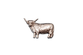 Handcrafted pewter Highland Cow pin badge featuring a detailed Scottish cattle design with butterfly clutch fastening on a white background.