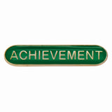 Achievement school bar badge in green with gold lettering and butterfly clutch fastening.