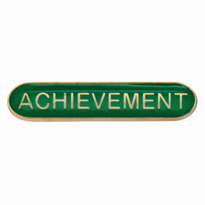 Achievement school bar badge in green with gold lettering and butterfly clutch fastening.