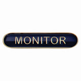 Monitor school bar badge in blue enamel with gold lettering and butterfly clutch fastening.