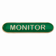 Monitor school bar badge in green enamel with gold lettering and butterfly clutch fastening.