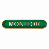 Monitor school bar badge in green enamel with gold lettering and butterfly clutch fastening.