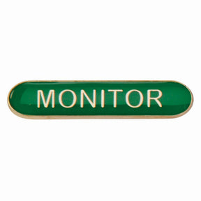Monitor school bar badge in green enamel with gold lettering and butterfly clutch fastening.