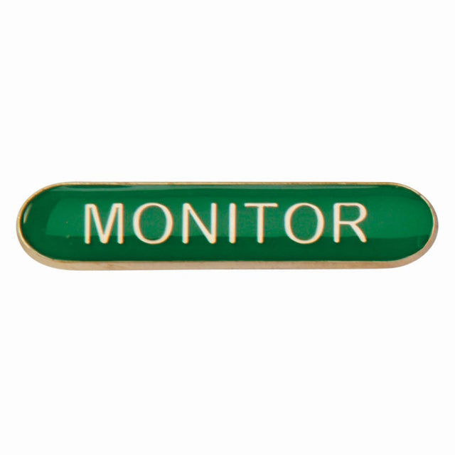 Monitor school bar badge in green enamel with gold lettering and butterfly clutch fastening.