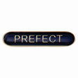 Prefect school bar badge in blue enamel with gold lettering and butterfly clutch fastening.