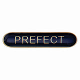 Prefect school bar badge in blue enamel with gold lettering and butterfly clutch fastening.