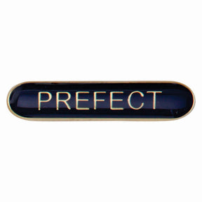 Prefect school bar badge in blue enamel with gold lettering and butterfly clutch fastening.