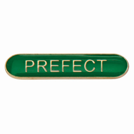 Prefect school bar badge in green enamel with gold lettering and butterfly clutch fastening.