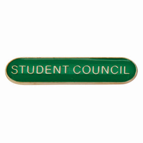 School student council bar badge in green enamel with gold lettering and butterfly clutch fastening.
