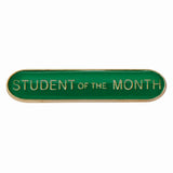 School student of the month bar badge in green enamel with gold lettering and butterfly clutch fastening.