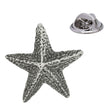 Antique silver five-armed starfish pewter lapel pin with textured surface and rear butterfly clasp
