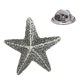 Antique silver five-armed starfish pewter lapel pin with textured surface and rear butterfly clasp