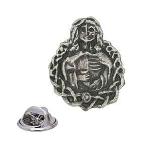 Antique silver Hel Norse mythology pewter lapel pin depicting half-living half-skeletal woman with decorative border and rear clasp