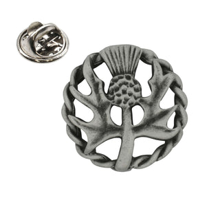 Antique silver Scottish thistle pewter lapel pin with textured thistle and Celtic circular woven border, clasp shown