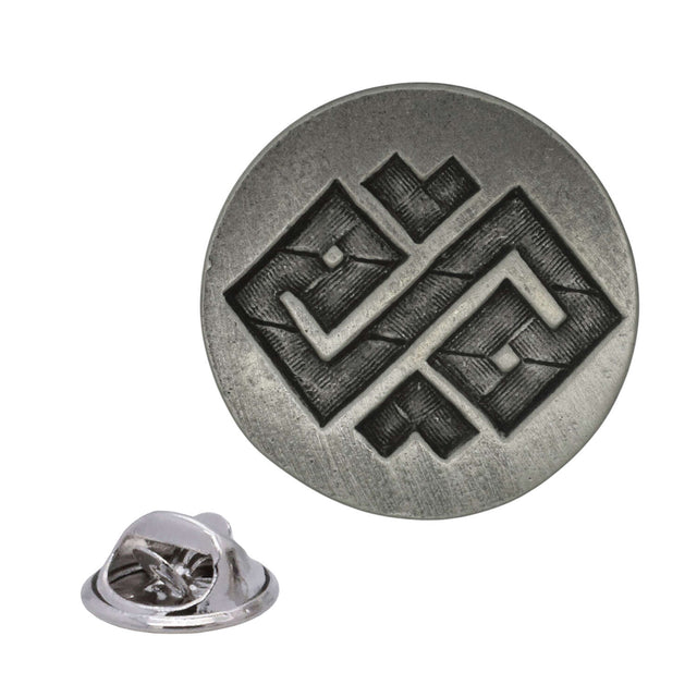 Antique silver round Wisdom pewter lapel pin with angular geometric design and rear butterfly clasp