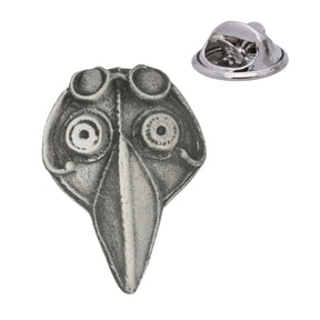 Bird mask pewter lapel pin badge with long pointed beak, round eye details and butterfly clutch fastening