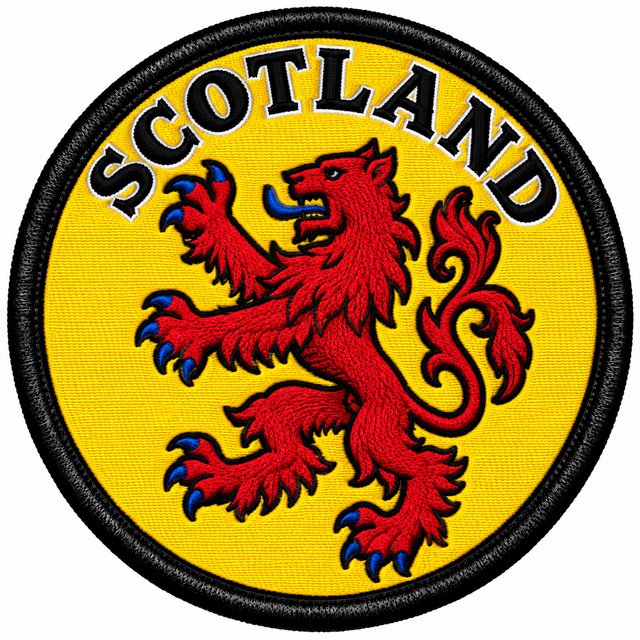 Round 80mm Scotland embroidered patch showing a red lion rampant with blue claws and tongue on yellow, with black SCOTLAND lettering, finished with a black border.