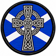 Round 80mm embroidered patch showing a white and black Celtic cross with knotwork over a blue and white Saltire, framed by a black border.
