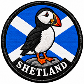 Round 80mm embroidered patch showing a puffin standing on a rock against a Saltire, with SHETLAND lettering along the bottom, framed by a black border.