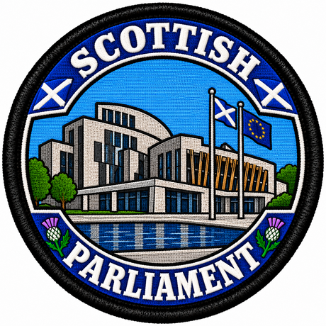 Round 80mm embroidered patch showing a stylised Scottish Parliament building with Scottish and European flags, thistles and SCOTTISH PARLIAMENT lettering, framed by a black border.