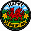Happy St David’s Day round embroidered patch featuring a red Welsh dragon, yellow daffodils, green hills and a black border