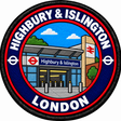 Round 80mm embroidered patch showing a stylised Highbury & Islington station entrance with red transport symbols, finished with a black border.