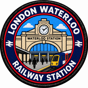 Round 80mm embroidered patch showing a stylised Waterloo station facade and clock with a passenger train and people outside, finished with a black border.
