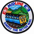 Round 80mm embroidered patch showing a smiling blue train with a yellow front travelling through green countryside, with MIDLINE and SIMPLY THE BETTER WAY! lettering, finished with a black border.