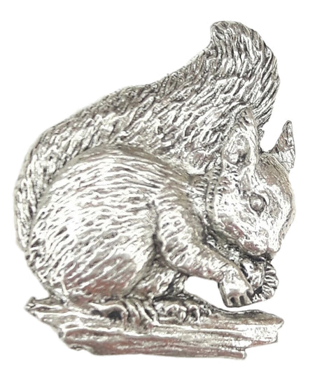 Detailed pewter squirrel pin badge holding an acorn with butterfly clutch fastening on a white background.