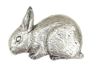 Detailed pewter rabbit pin badge in a resting pose with butterfly clutch fastening on a white background.